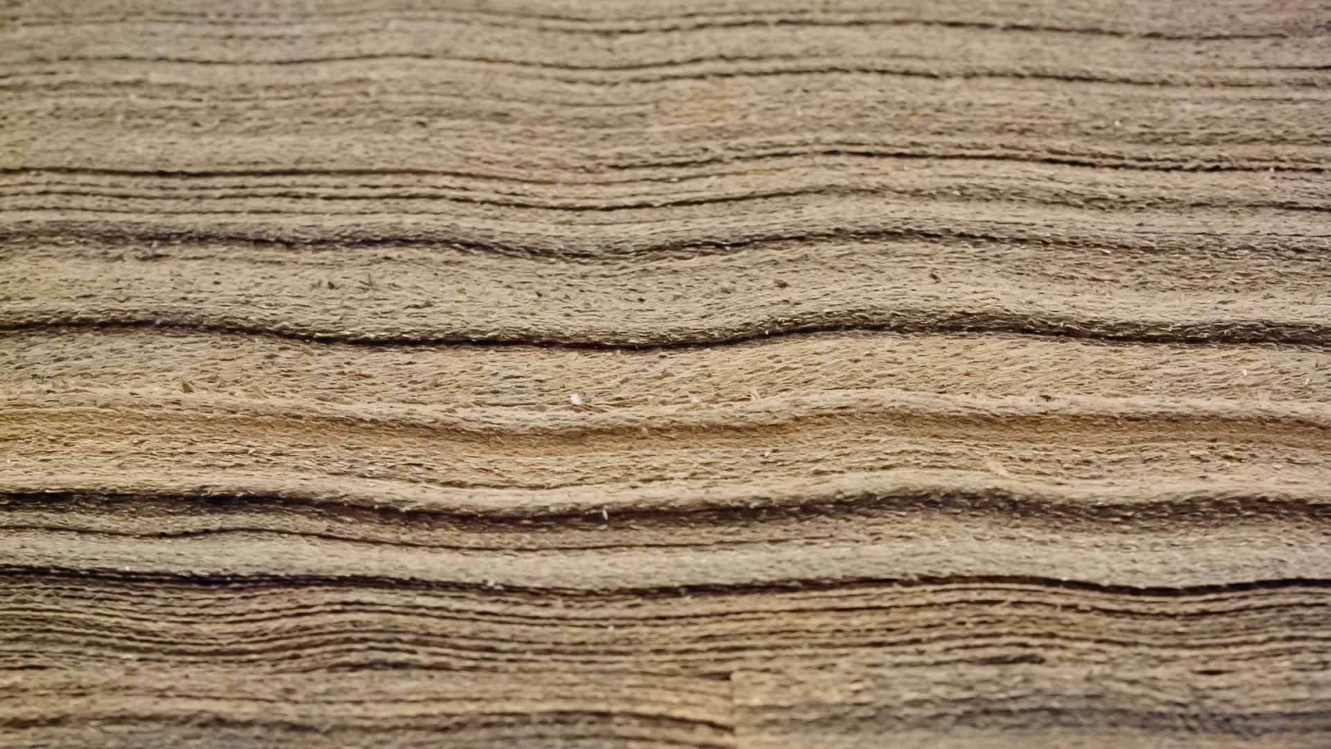 An image of stacked paper material representing the anatomy of the skin. 