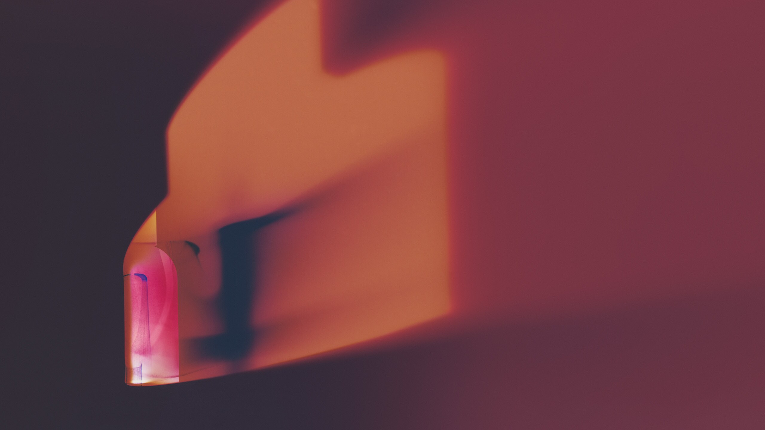 abstract art of fragrance bottle featuring orange, purple and pink