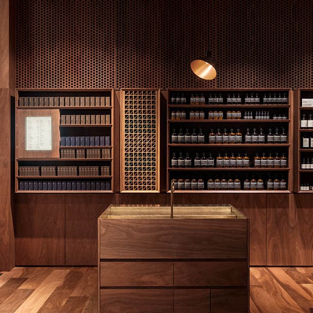 A customer experience basin in-front of two large shelving units. 