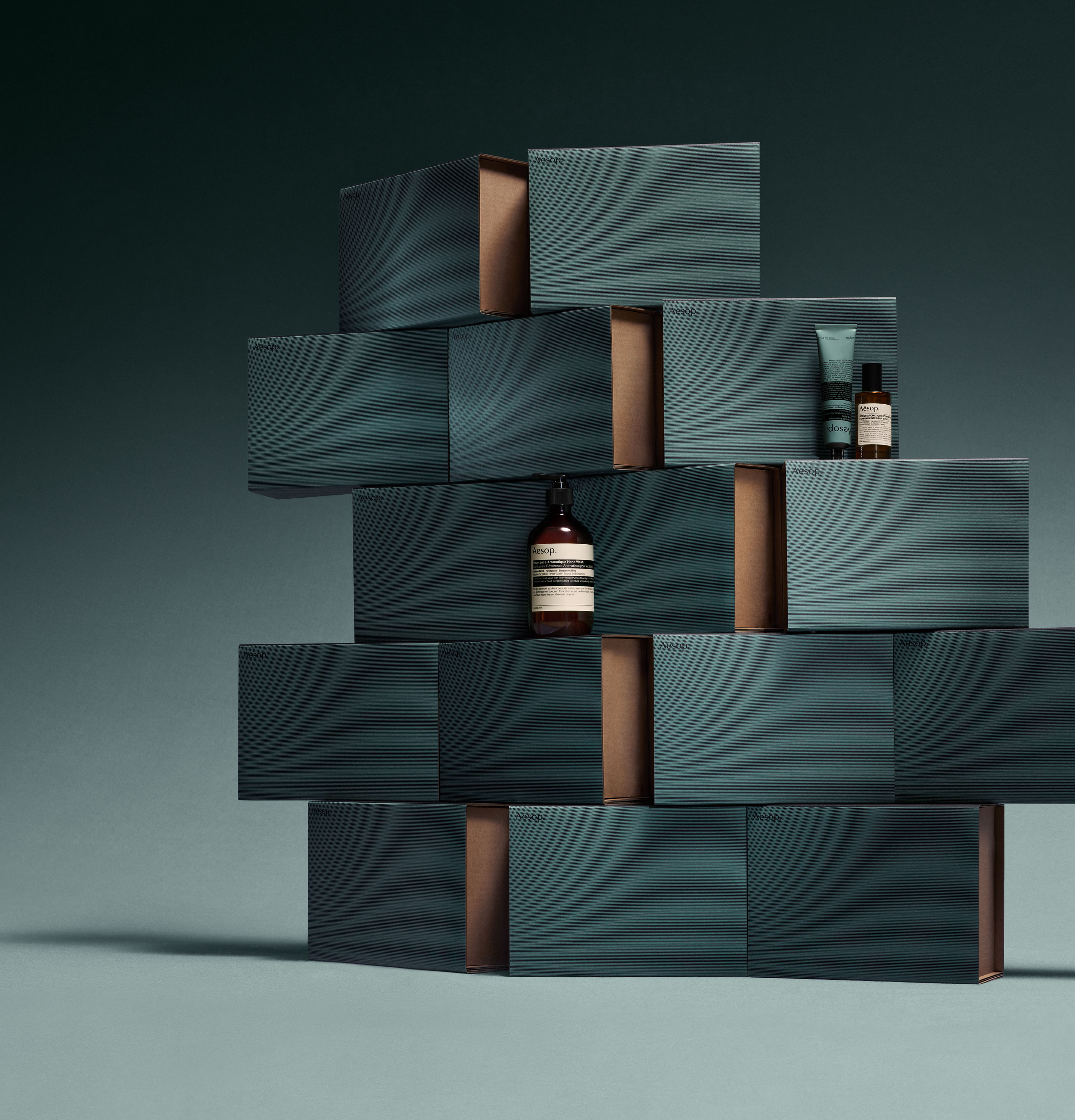 stacks of teal gift boxes with product
