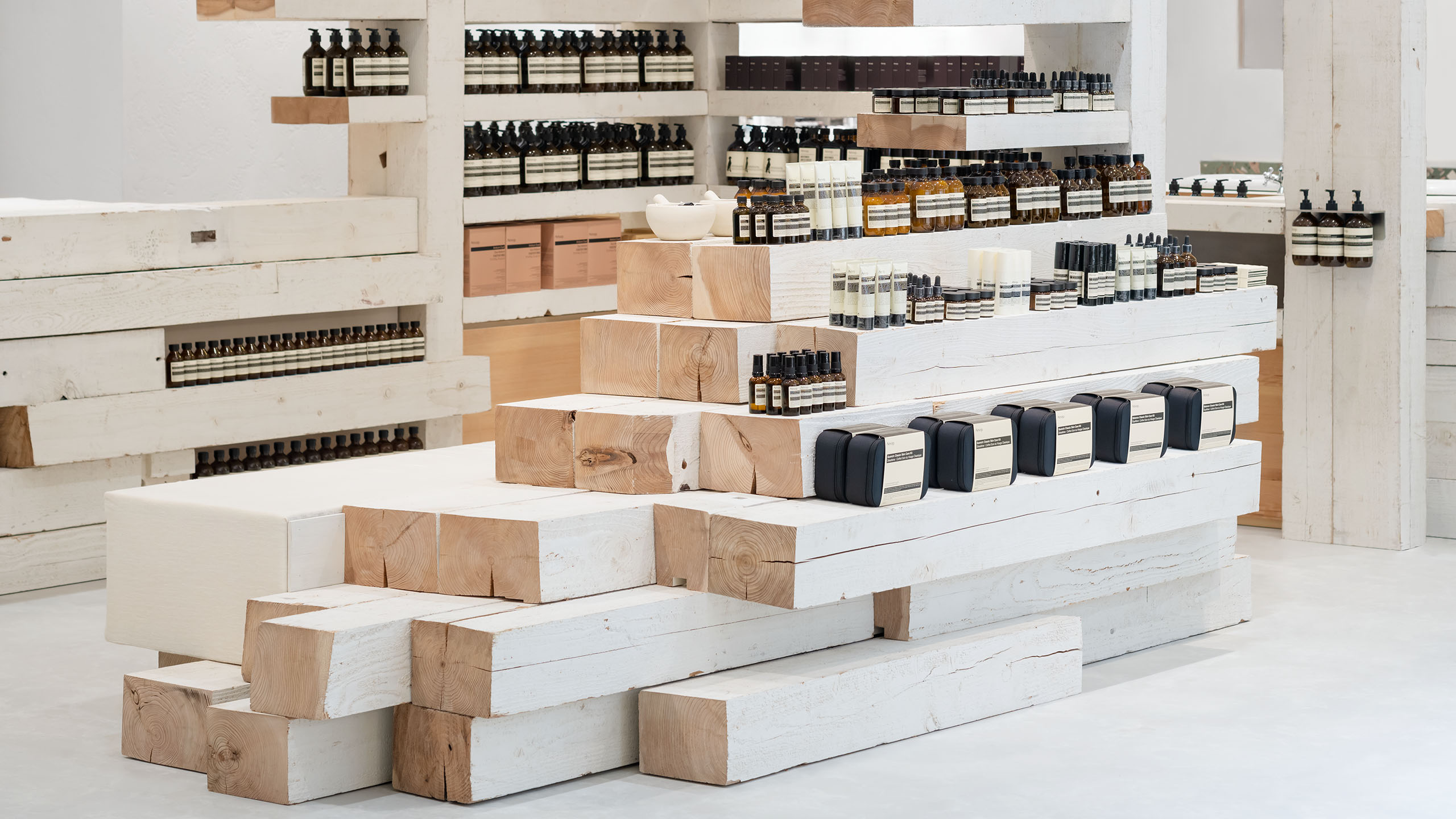 Aesop hankyu umeda 8F Interior, products line up at the store which has the term of 'A modular arrangement of repurposed timber'