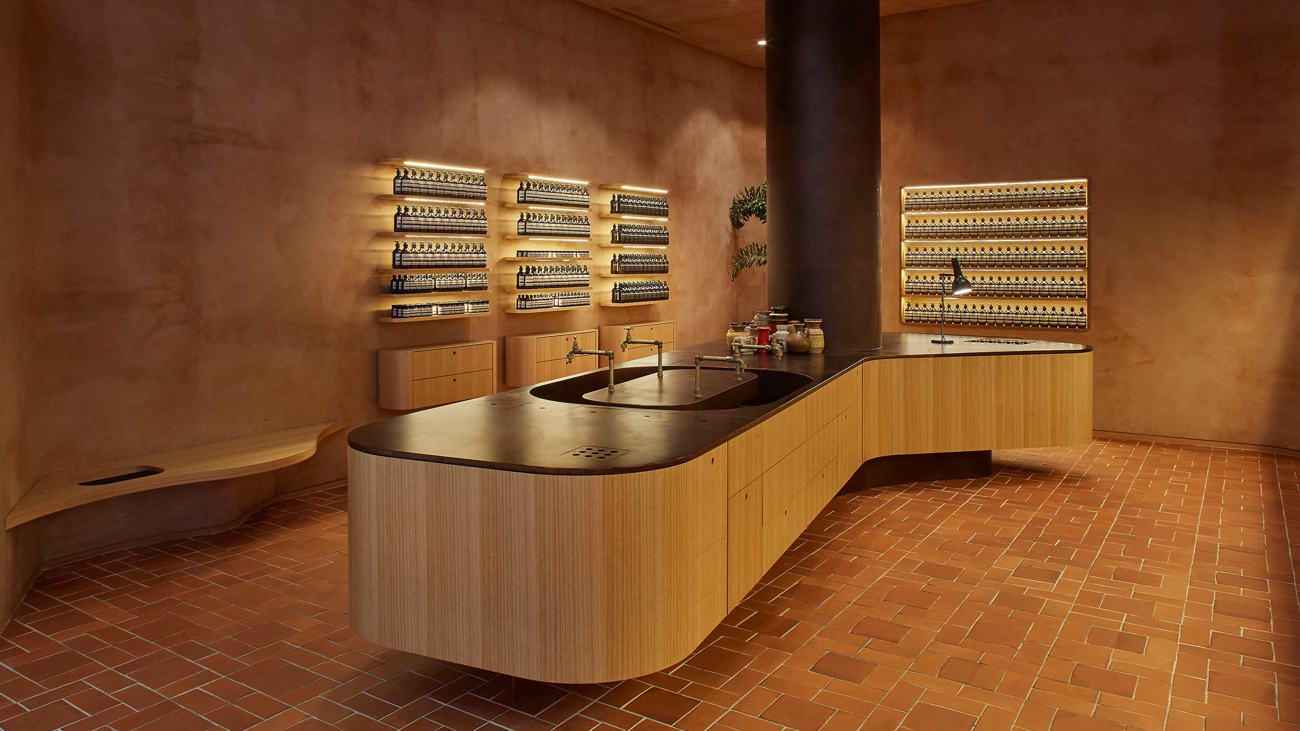 The customer service counter with a large, dark column that reaches the ceiling.
