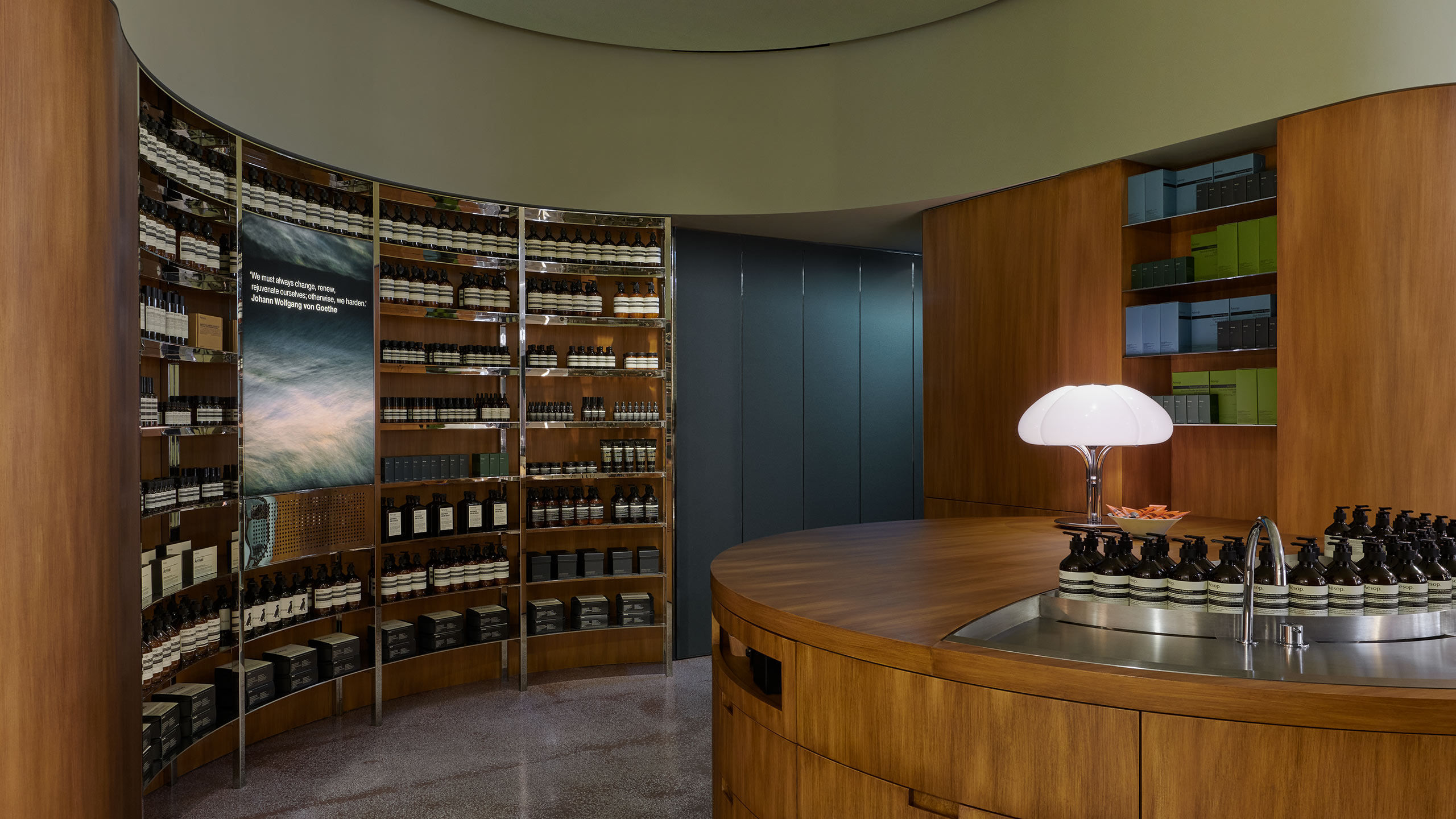 Aesop Hysan place store interior, featuring products on open steel shelves