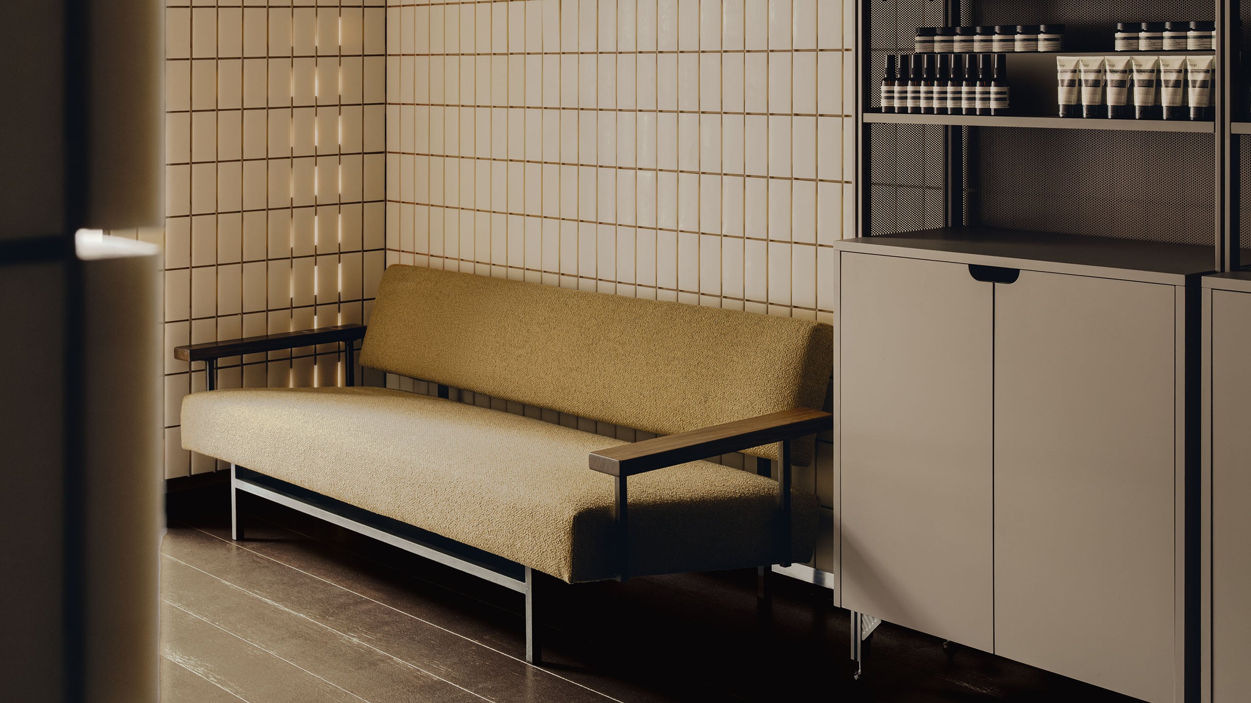 Aesop Knightsbridge store interior bench seating and cabinets.