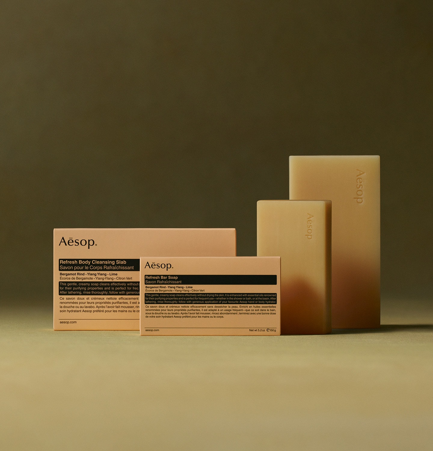 Refresh Body Cleansing Slab blocks and carton packaging placed in front of green textured background