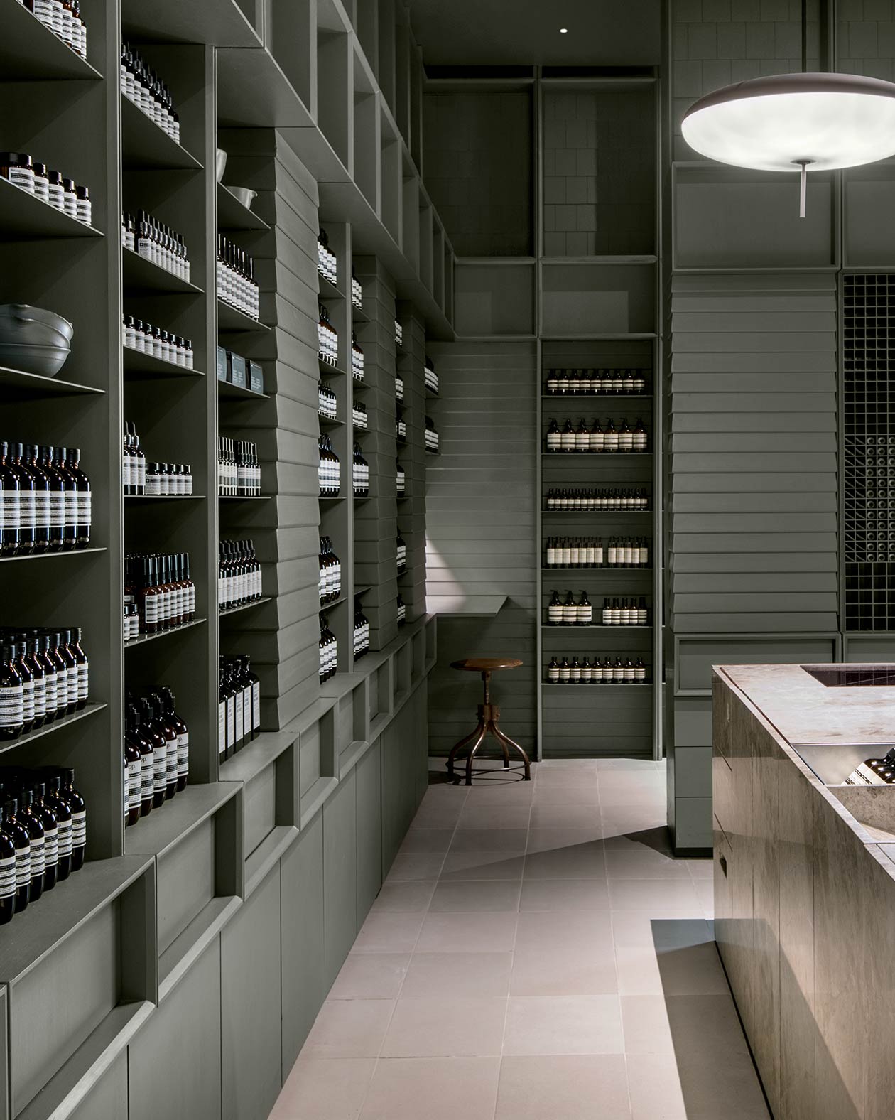 Aesop San Francsico Centre store interior, with a brown stool placed in the corner.