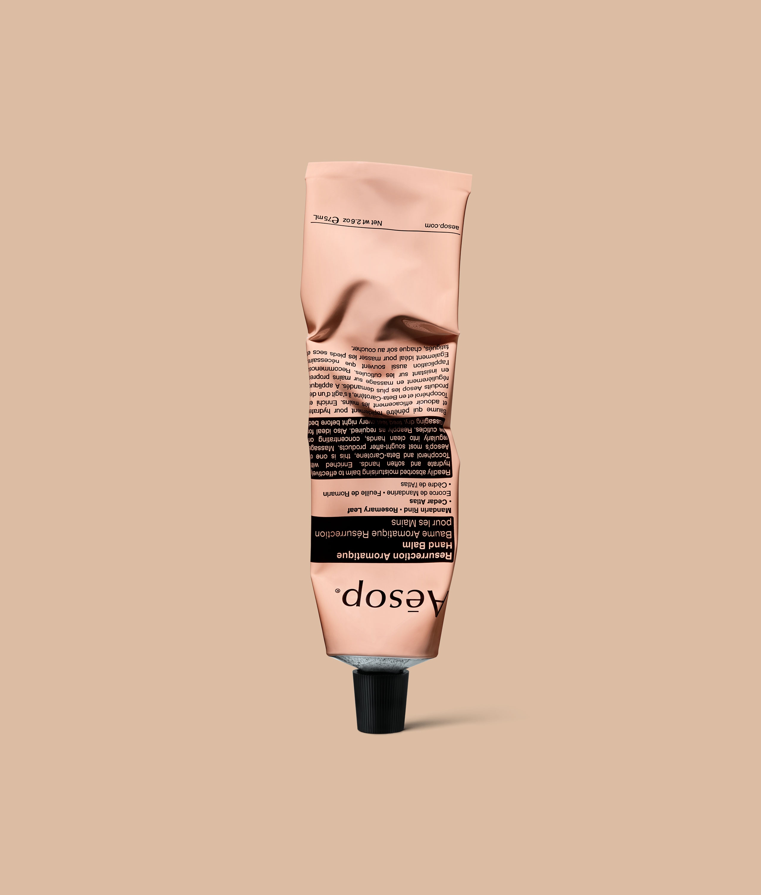 Resurrection hand balm 75m: in aluminium tube on peach coloured background