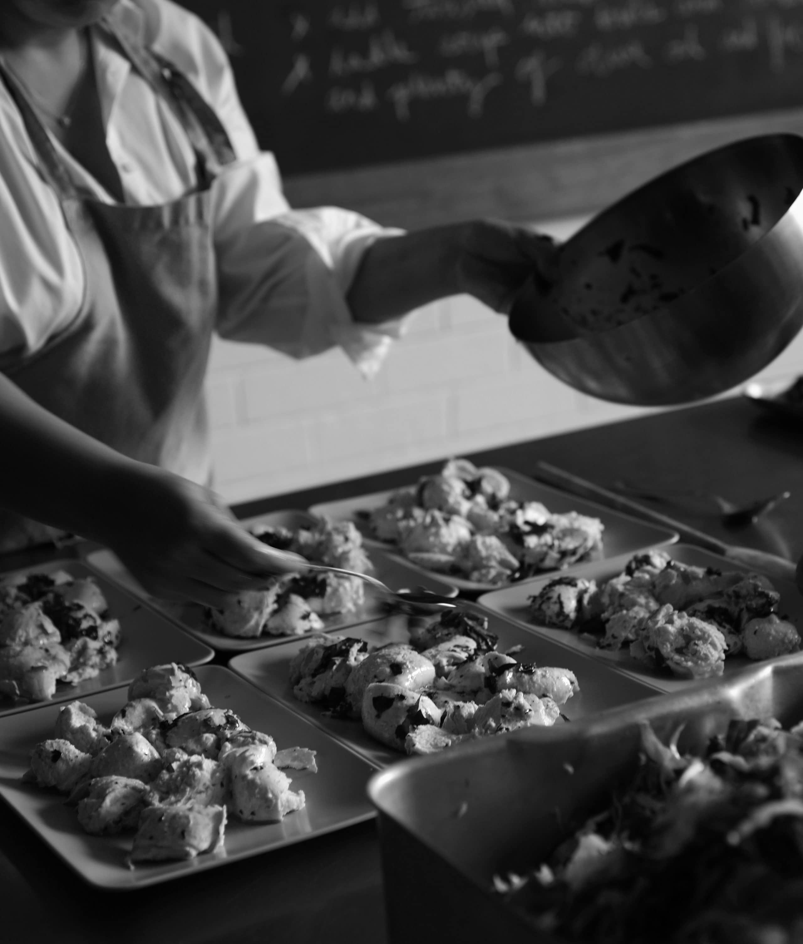 An Aesop employee prepares a meal to share with colleagues.