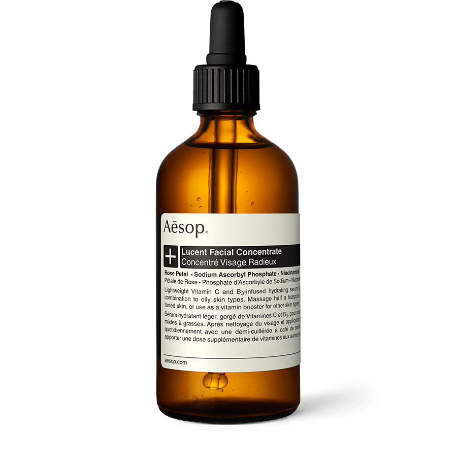 Lucent Facial Concentrate in an amber glass bottle with a pipette.
