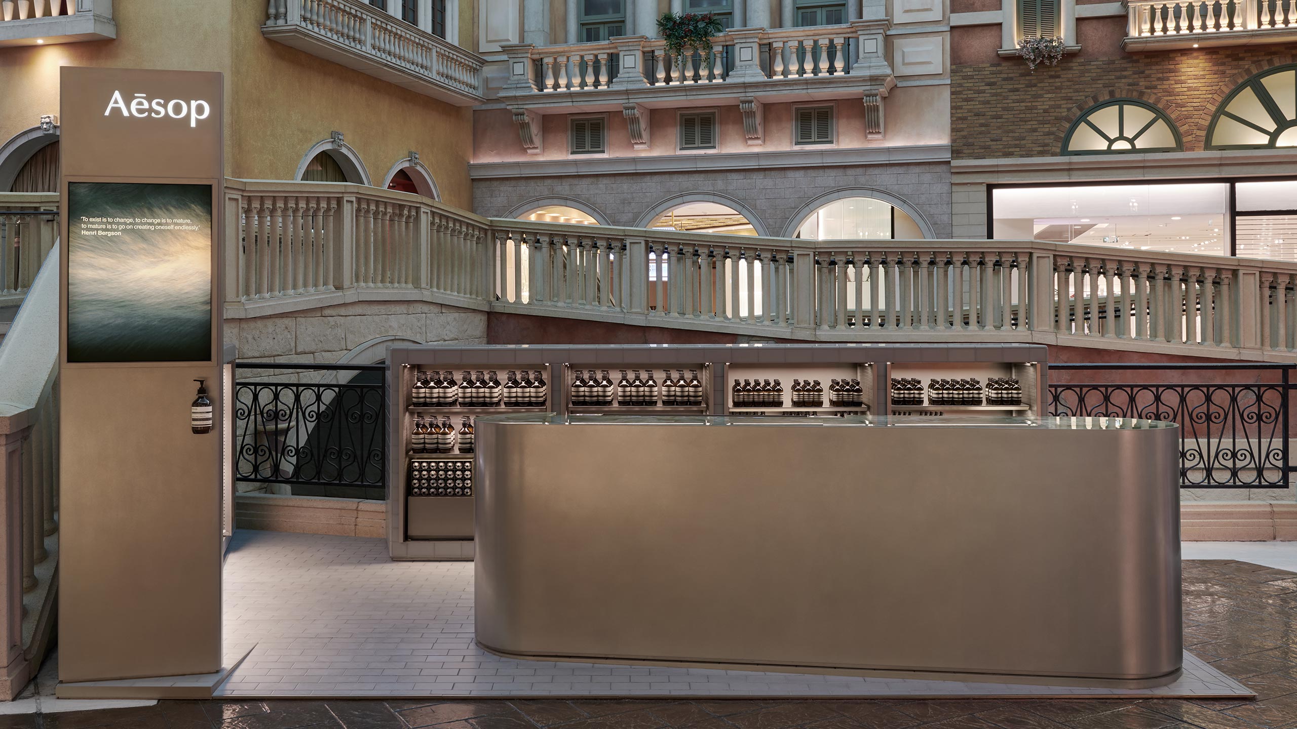 Aesop Venetian Macau store counter with a rounded counter and products at the back