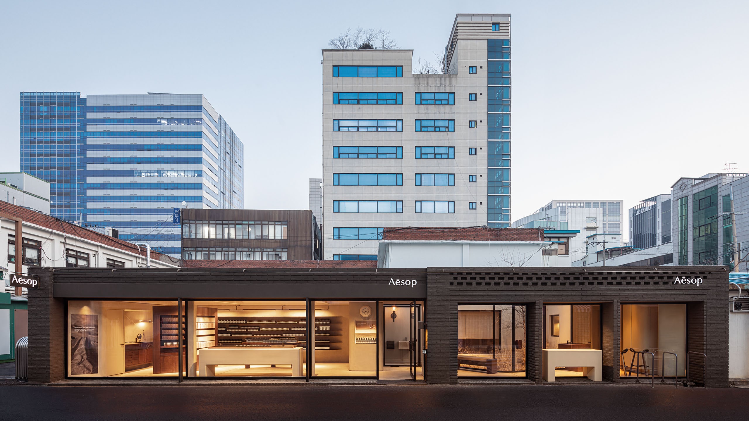 A look at Aesop Seongsu from the street, nestled into the Seoul cityscape.