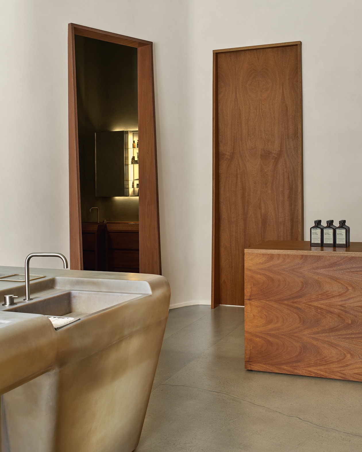 store interior shot featuring corner of basin, wooden door ways and a wooden counter