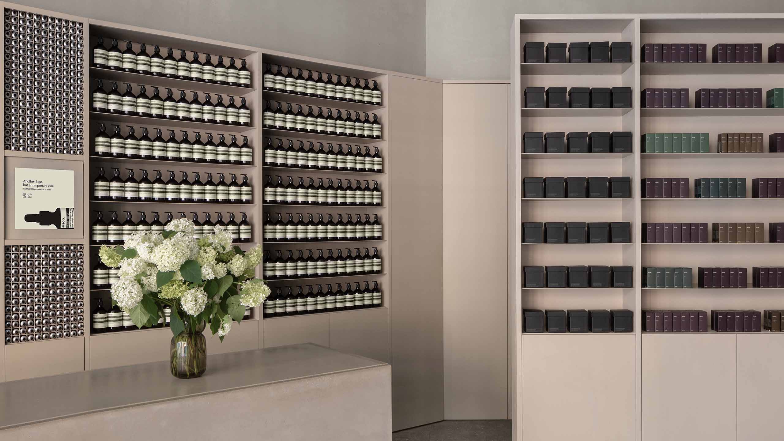 Aesop Eaton Centre Toronto Store floral arrangement with product displayed on shelving in the background