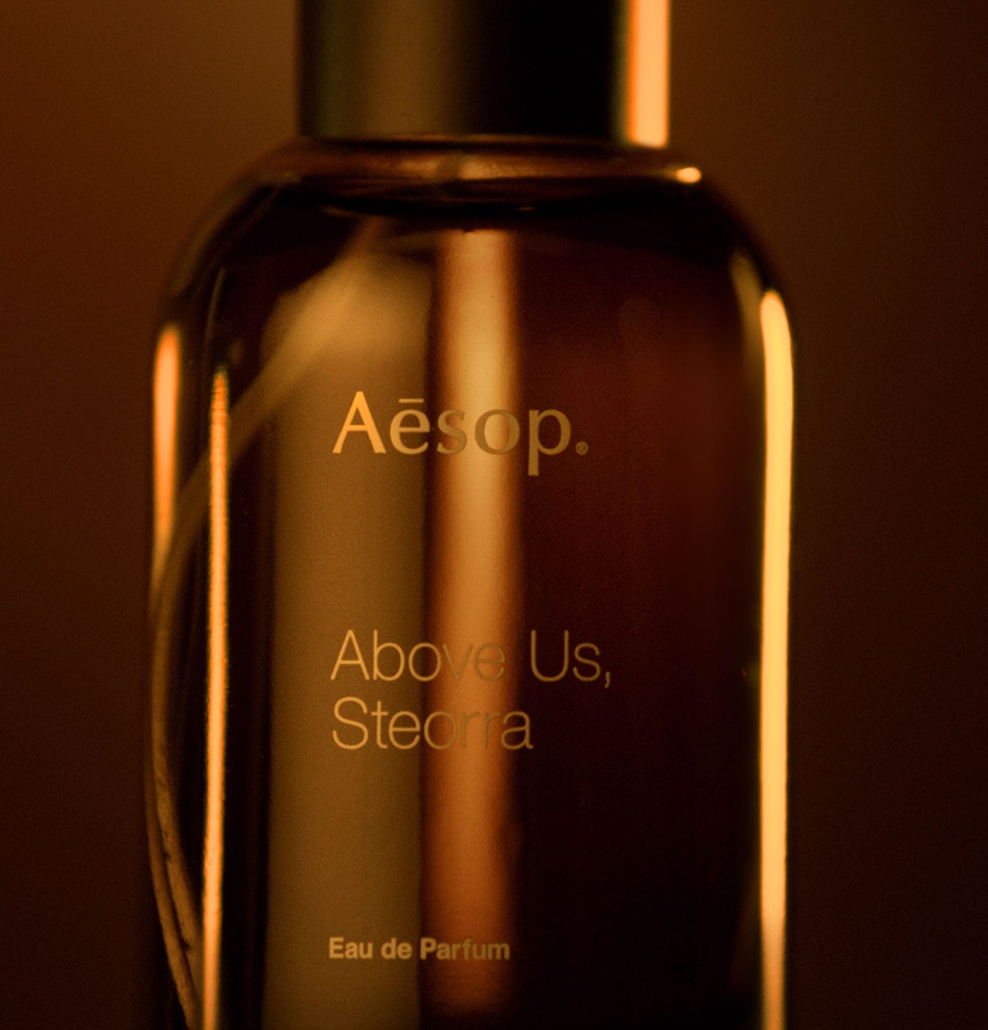 Above us, Steorra EDP amber bottle zoomed in shot