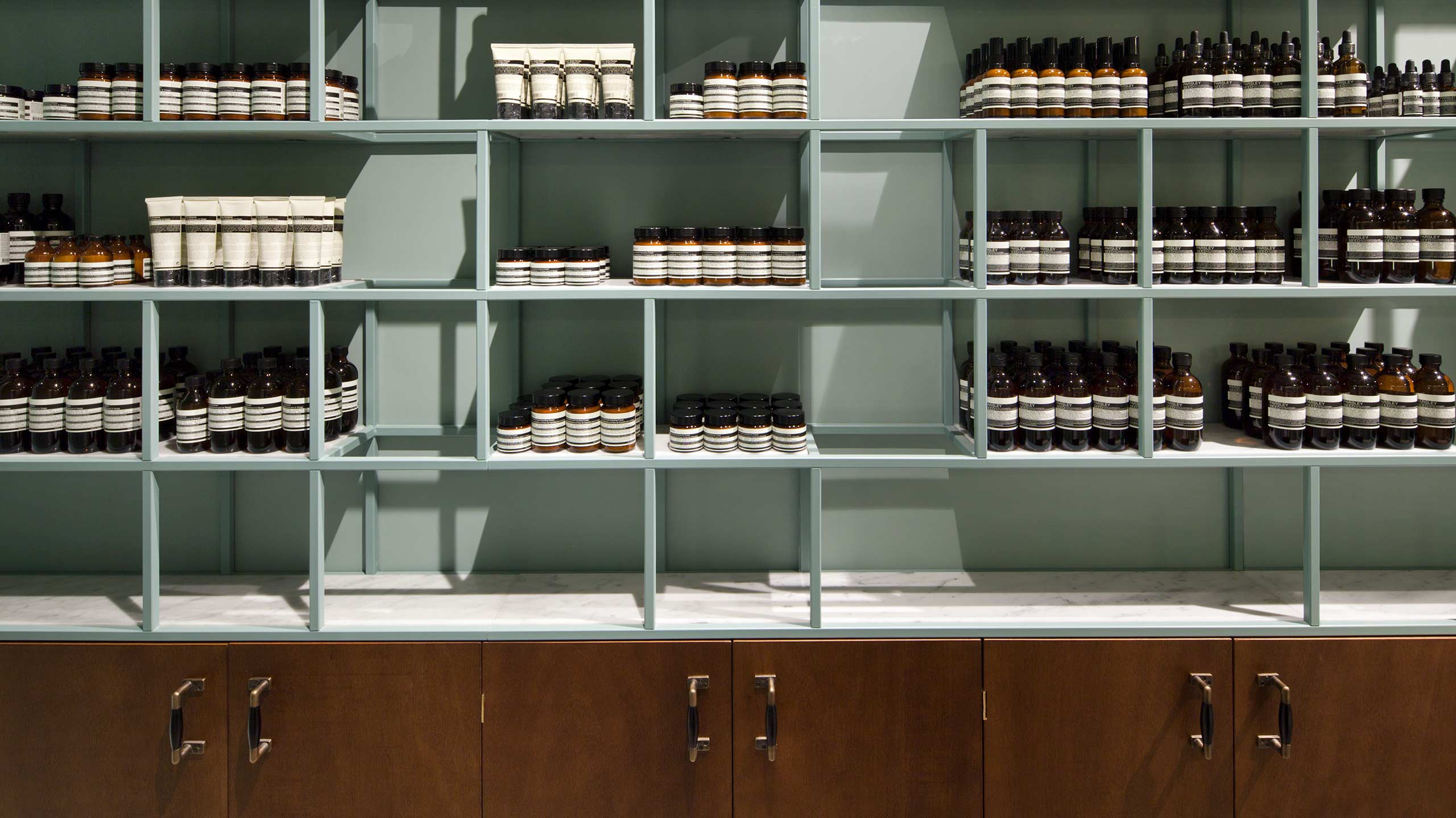 Aesop Passy store interior displaying product on shelving and storage units