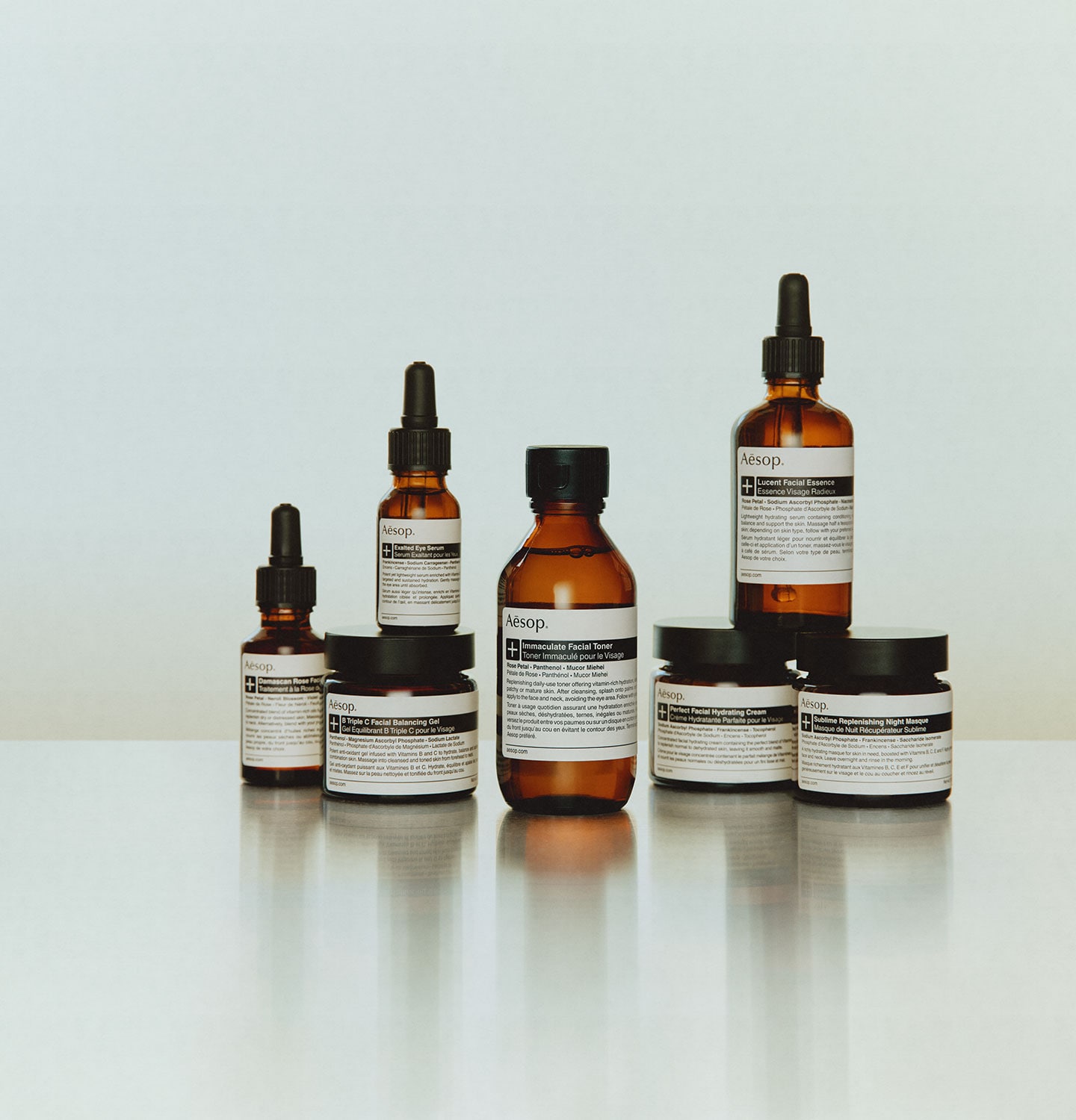 Aesop skincare plus range products placed on a metalic surface