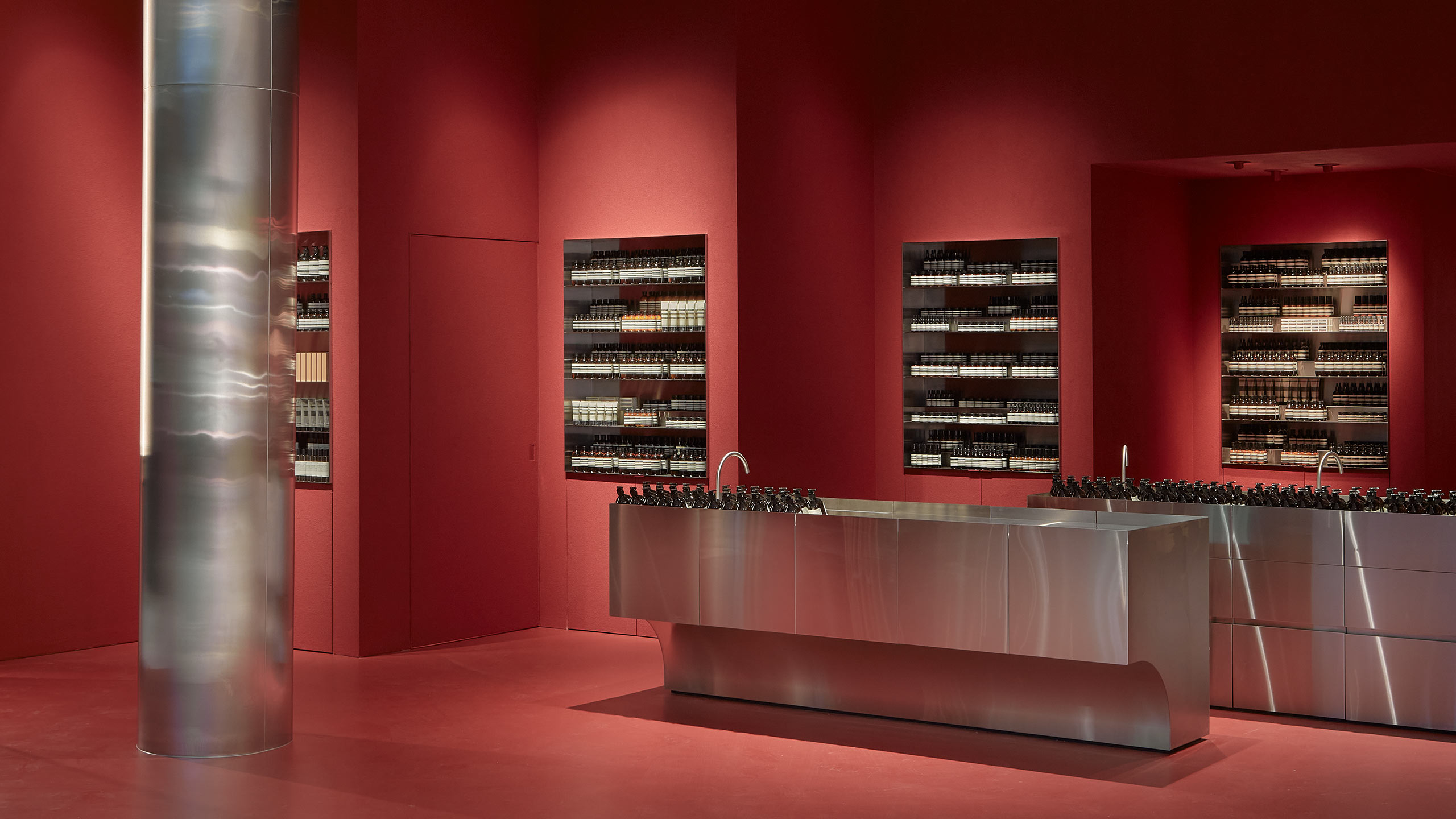 A brushed stainless steel column is on the left. On the right, a similarly stainless steel counter.