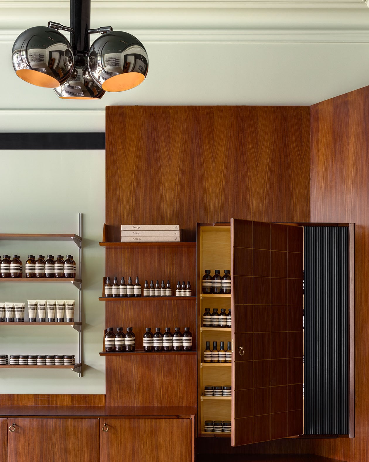 Aesop Madison Avenue store interior featuring wood paneling walls and product shelves