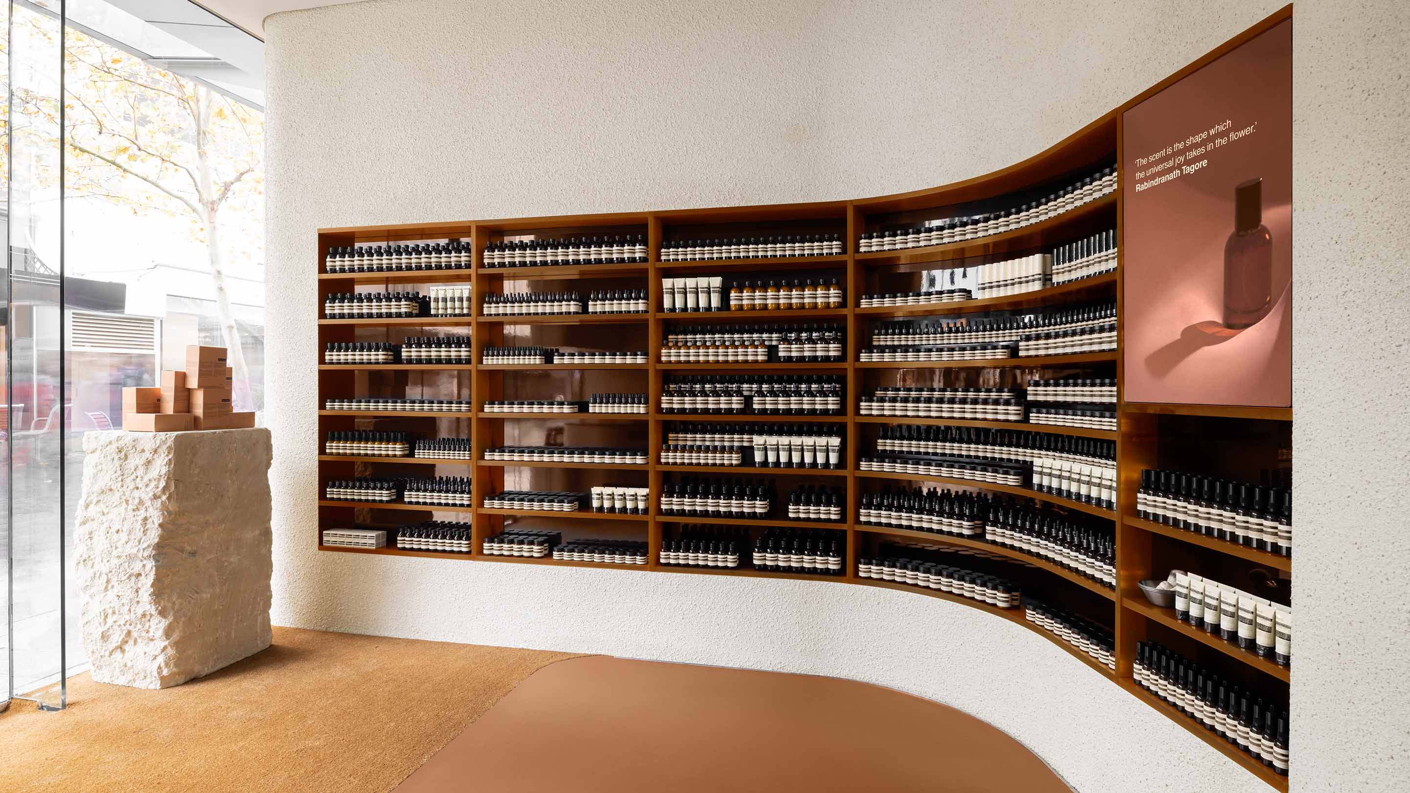 Aesop Perth City interior with wooden shelves displaying Aesop products 