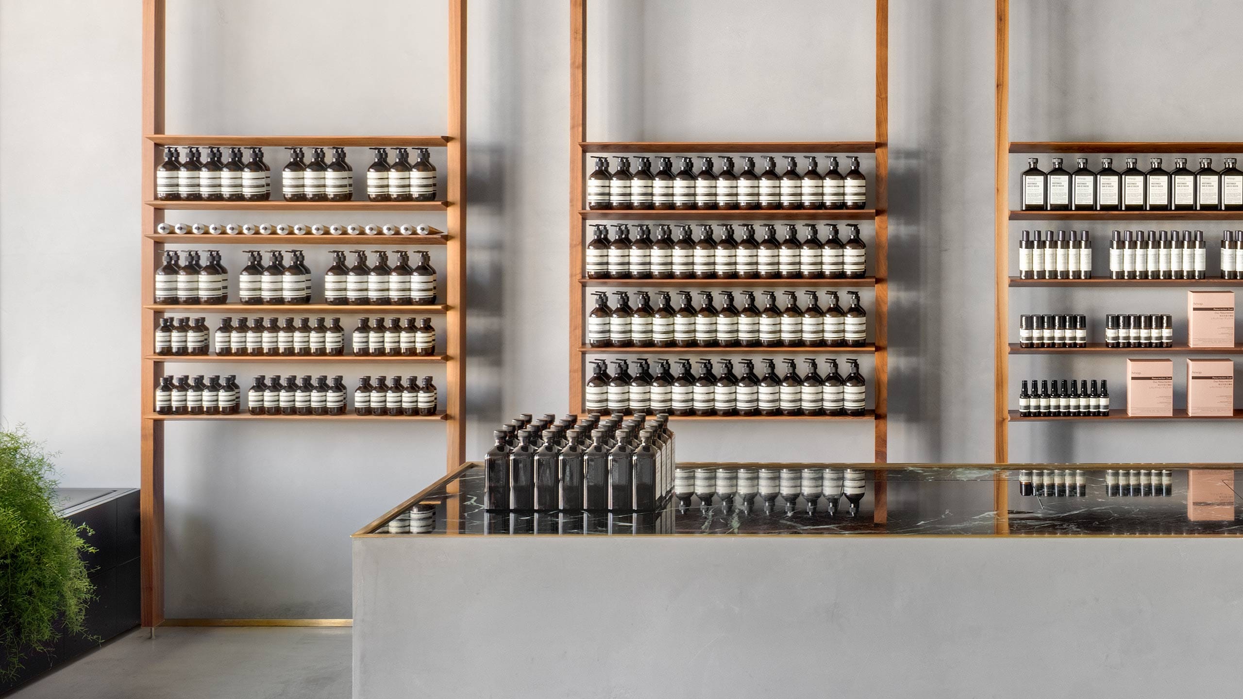 Aesop Mouthwash bottles neatly arranged on top of a marble counter.