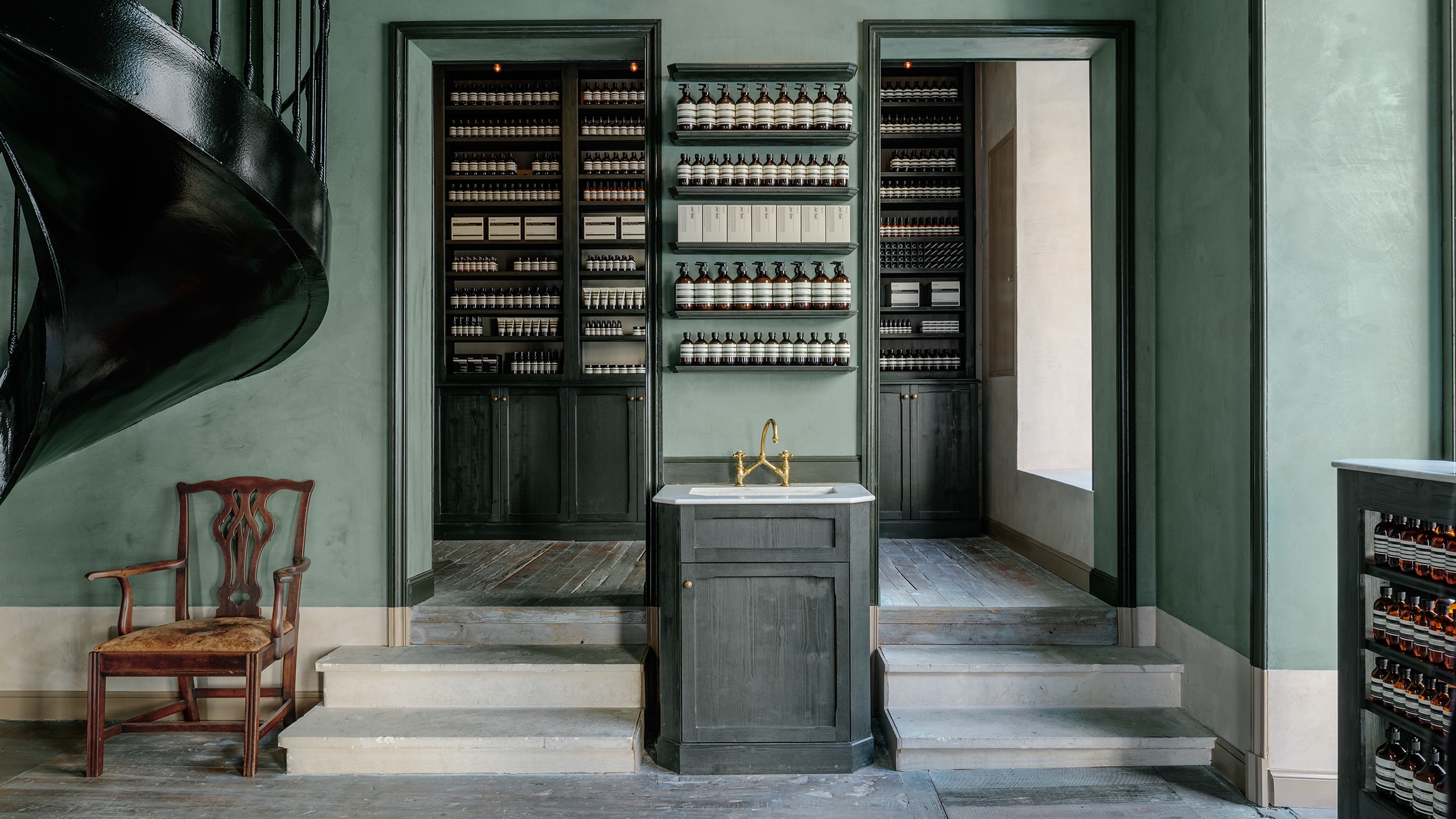 Aesop Bordeaux store interior featuring furniture and products on shelving