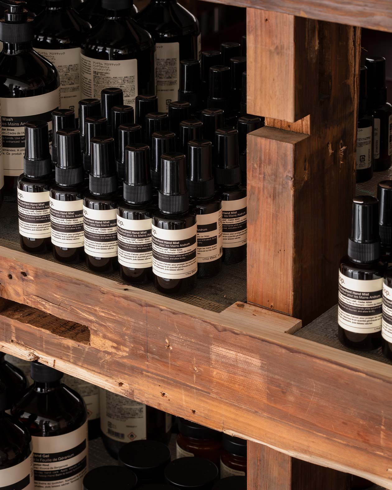 Aesop hand care products on the raw beams shelves
