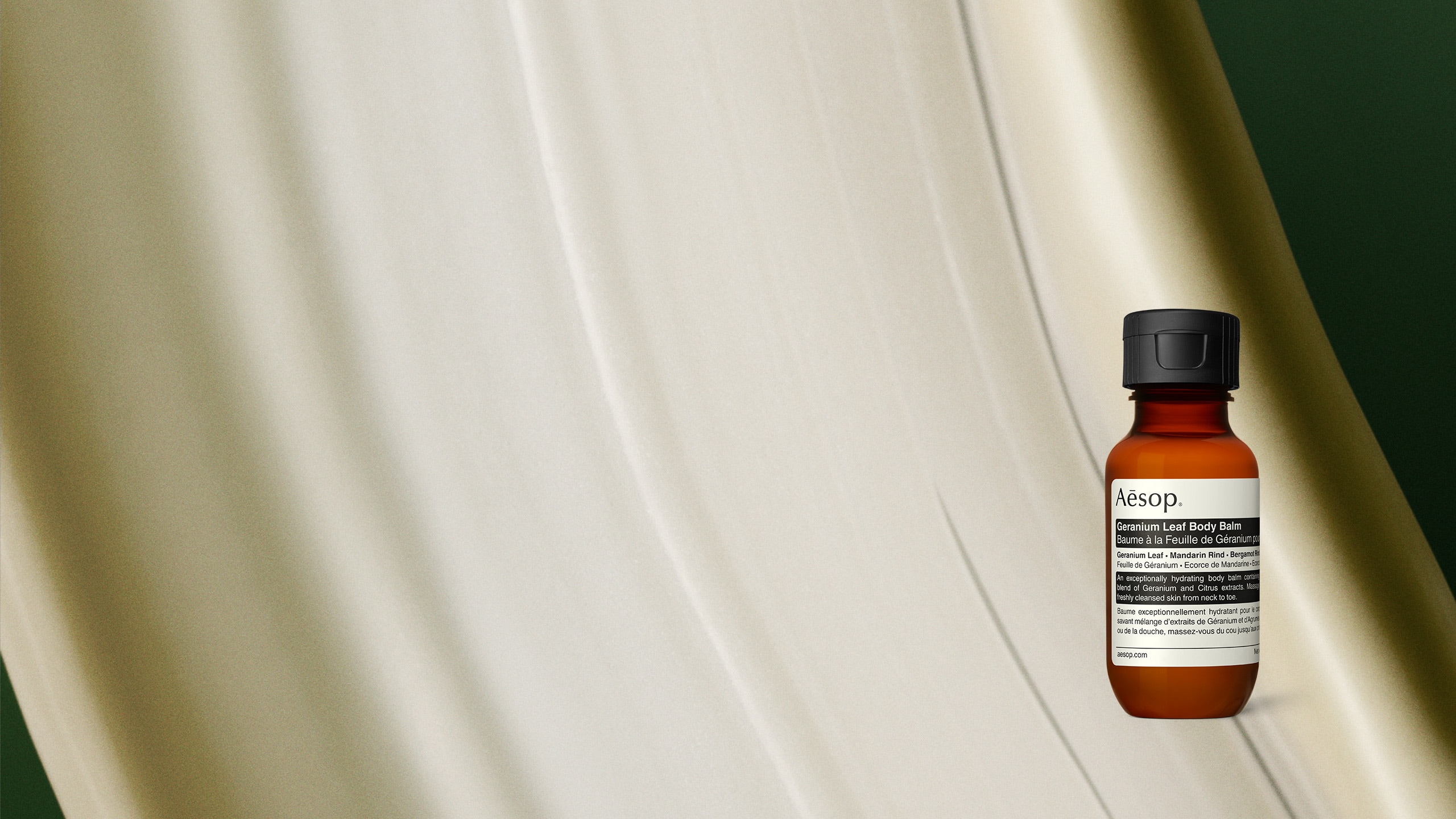 Geranium Leaf Body Balm displayed against a backdrop of its texture.
