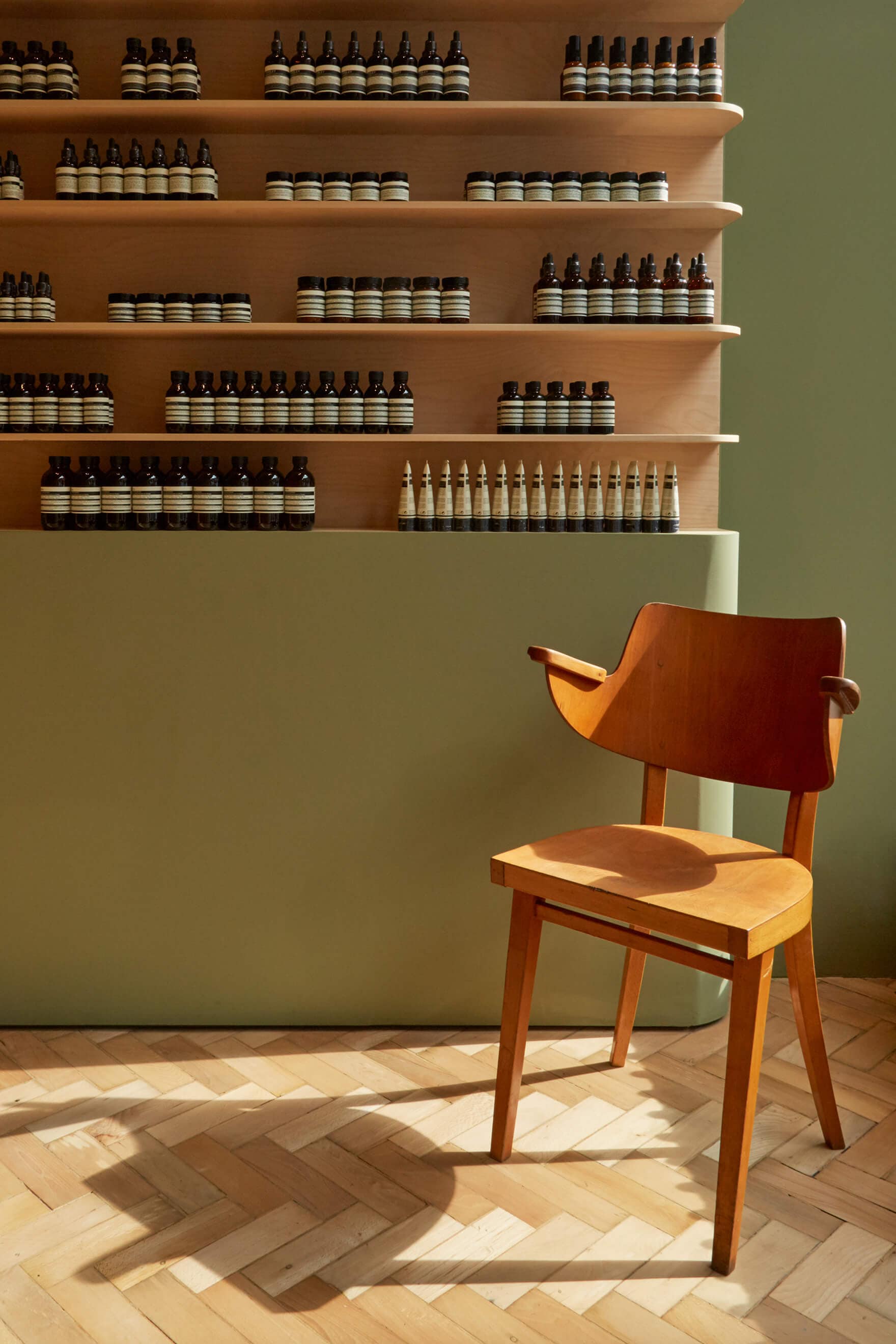 Aesop store, product on shelves, chair