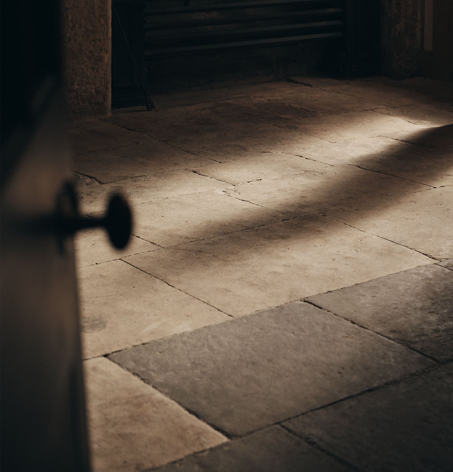 Abstract shot of brick flooring and a door knob